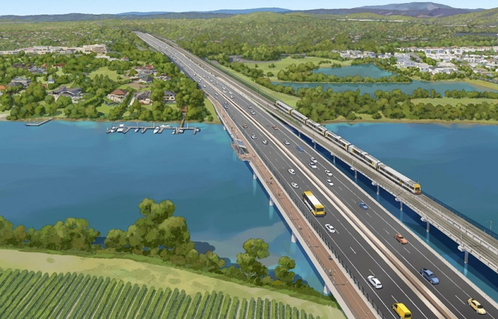 Construction site aerial view of a future freeway corridor with bridge works and earthworks on the Gold Coast region.