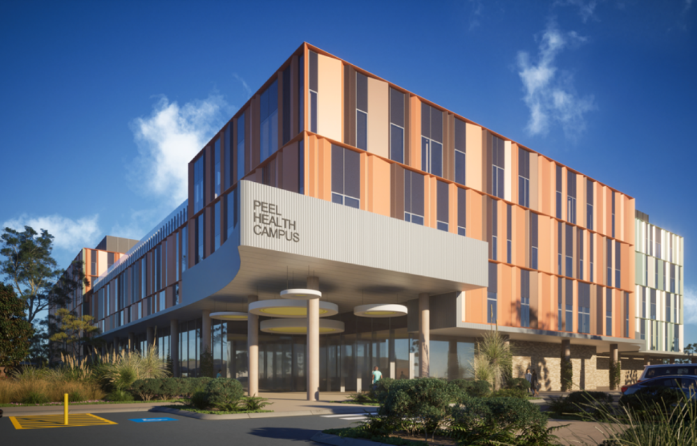 Rendering of a planned hospital development beside an existing health campus in Western Australia’s Peel region, featuring expanded emergency and specialist care facilities.